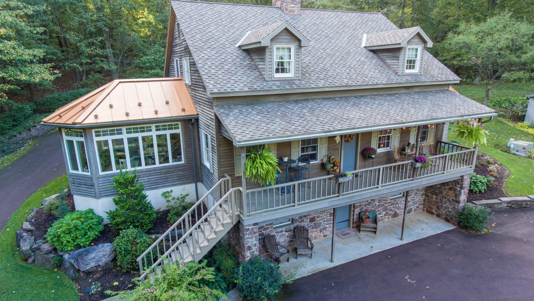 residential real estate listing with second story balcony and sunroom for sale in pa