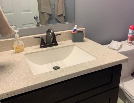 modern bathroom sink and accessories in new home for sale