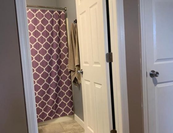 open white door leading to bathroom in new home for sale