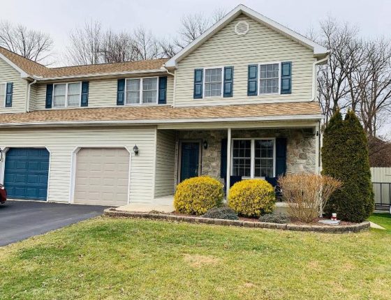 front lawn and landscaped shrubbery on new home for sale