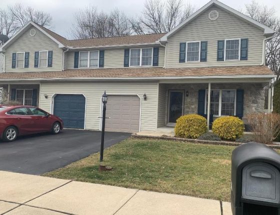 front lawn and driveway of new home for sale in wilson school district