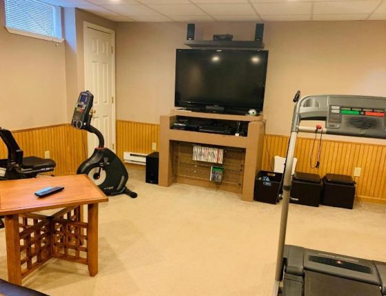 basement television and exercise equipment in new home for sale basement